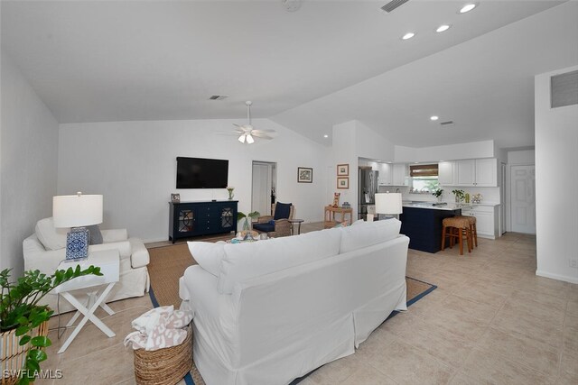 living area featuring ceiling fan, lofted ceiling, recessed lighting, visible vents, and baseboards