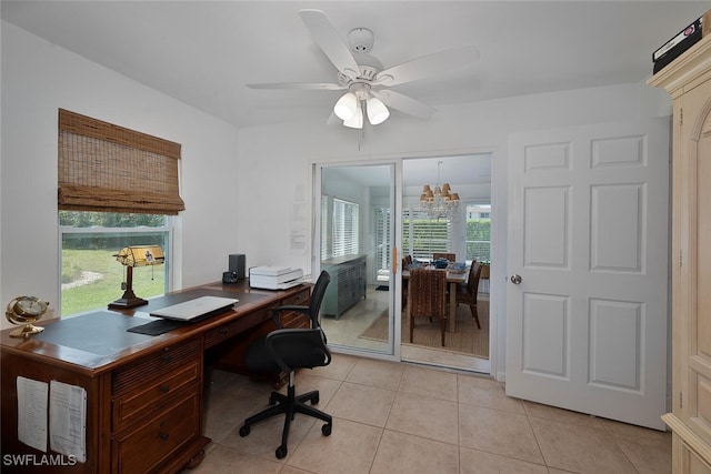 office featuring ceiling fan with notable chandelier and light tile patterned floors