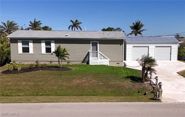 view of front of property with driveway and a front lawn