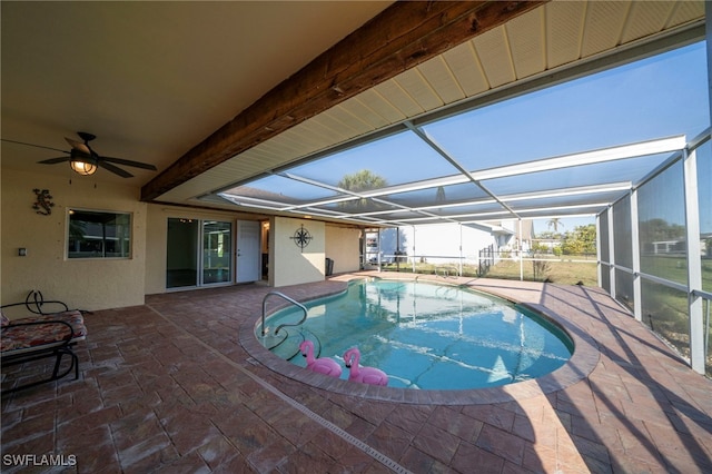 outdoor pool featuring a patio area, a lanai, and a ceiling fan