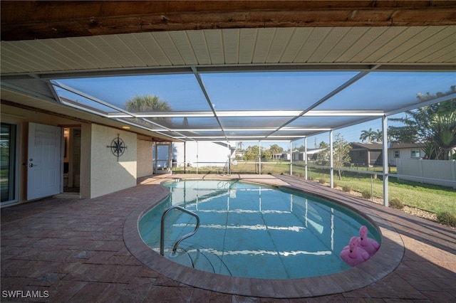 view of swimming pool with a lanai, a fenced in pool, and a patio