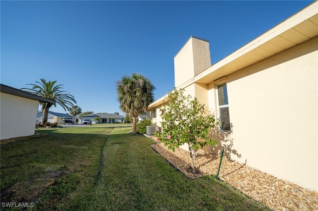 view of yard with a residential view and central AC