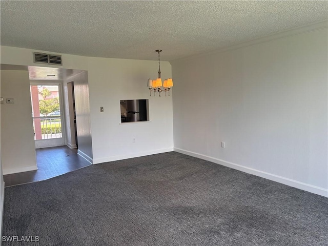 unfurnished room featuring a chandelier, a textured ceiling, visible vents, baseboards, and dark colored carpet