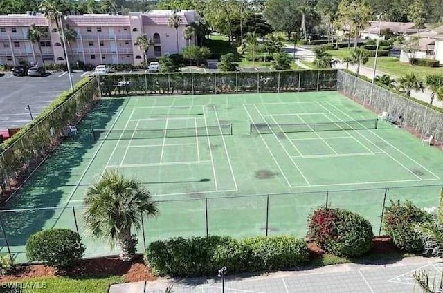 view of sport court with fence