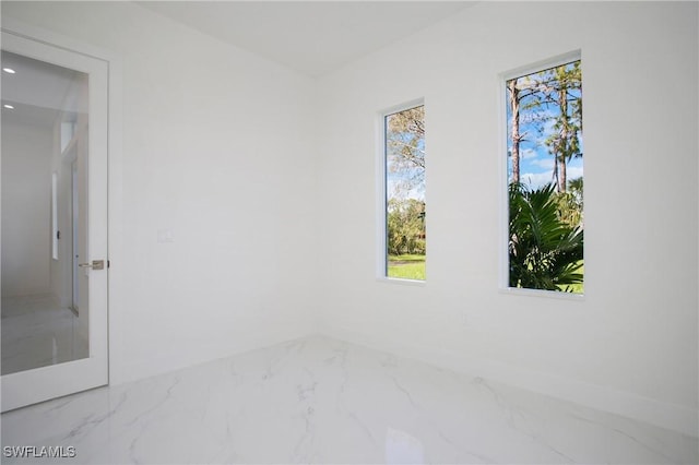 empty room featuring marble finish floor