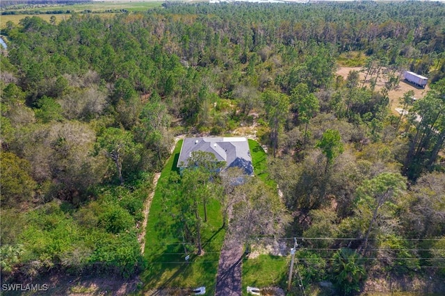 aerial view featuring a view of trees