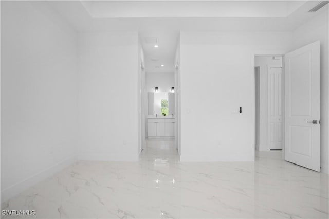 empty room featuring marble finish floor, recessed lighting, visible vents, and baseboards