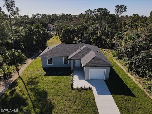 aerial view featuring a wooded view