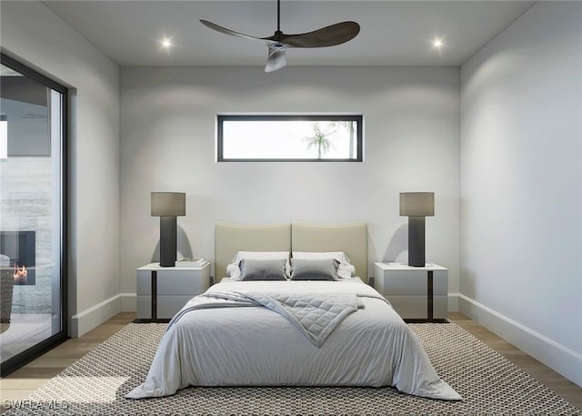 bedroom featuring access to outside, ceiling fan, baseboards, and wood finished floors