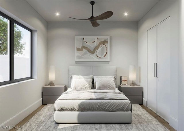 bedroom featuring recessed lighting, ceiling fan, baseboards, and wood finished floors