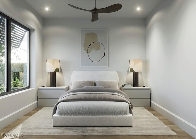 bedroom with ceiling fan, light wood finished floors, recessed lighting, and baseboards