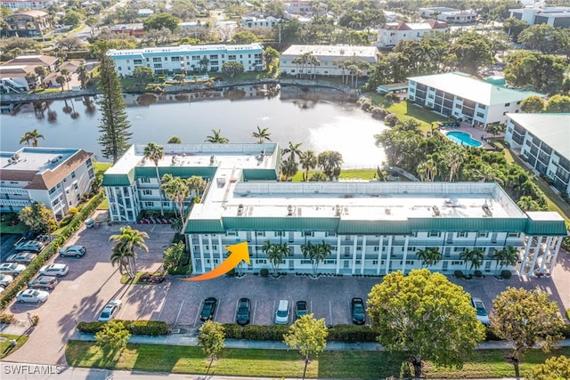 birds eye view of property with a water view