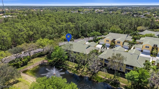 aerial view with a wooded view and a residential view