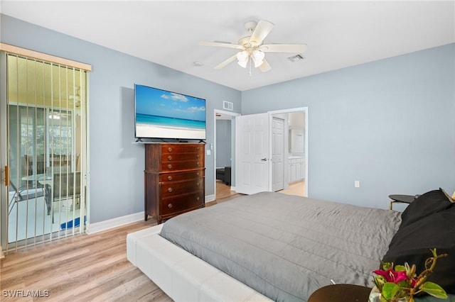 bedroom with visible vents, a ceiling fan, baseboards, and wood finished floors