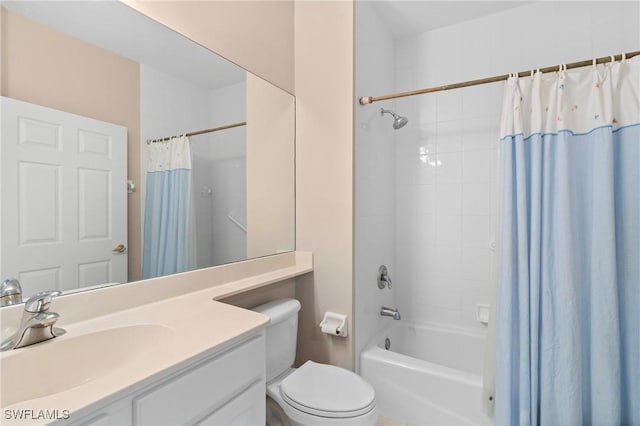 full bath featuring toilet, vanity, and shower / tub combo