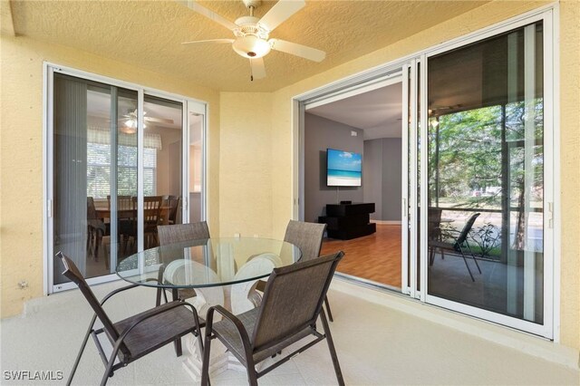 view of patio / terrace featuring outdoor dining space and a ceiling fan