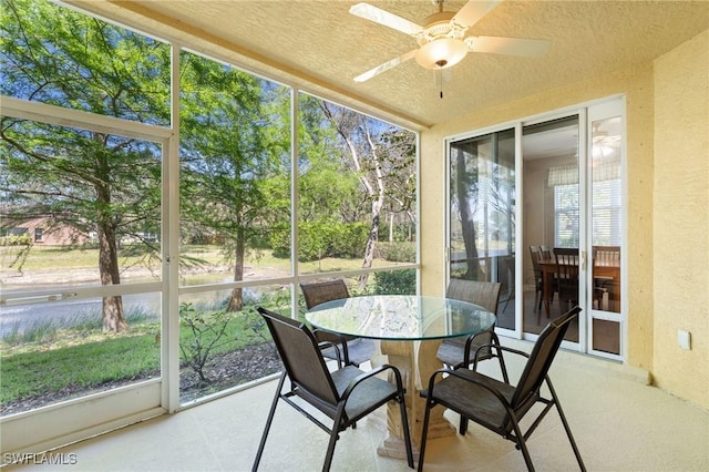 sunroom with a ceiling fan