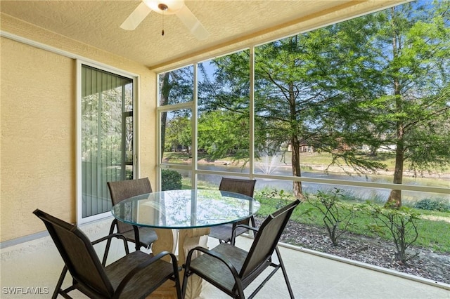 sunroom featuring a ceiling fan