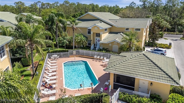 community pool with a patio area