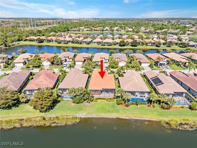 birds eye view of property featuring a residential view and a water view