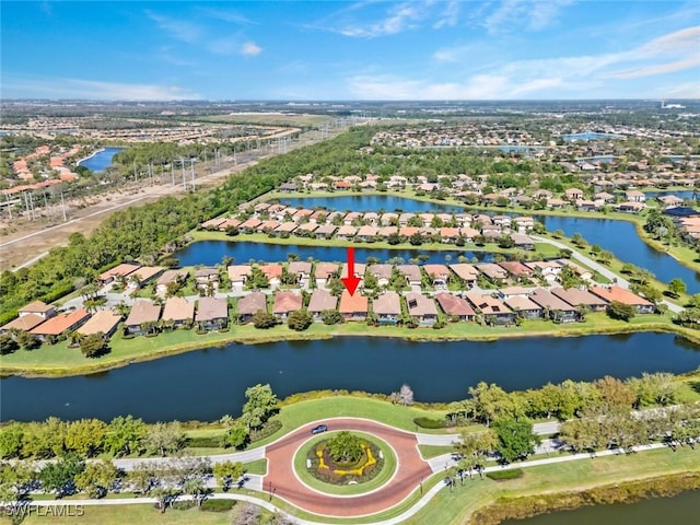 birds eye view of property with a water view and a residential view
