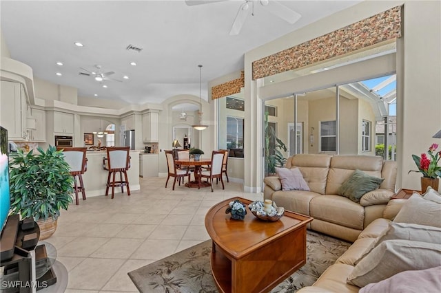 living room featuring light tile patterned floors, visible vents, recessed lighting, and ceiling fan