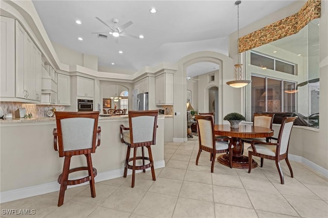 dining space with visible vents, baseboards, light tile patterned floors, recessed lighting, and a ceiling fan