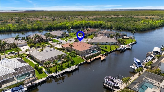 aerial view featuring a residential view and a water view