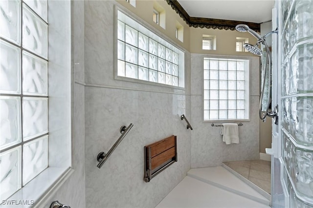 full bath featuring a tile shower