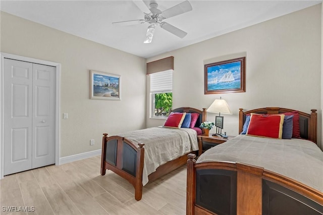 bedroom with baseboards, ceiling fan, and light wood finished floors