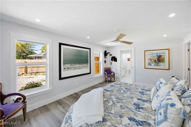 bedroom with recessed lighting, baseboards, and wood finished floors