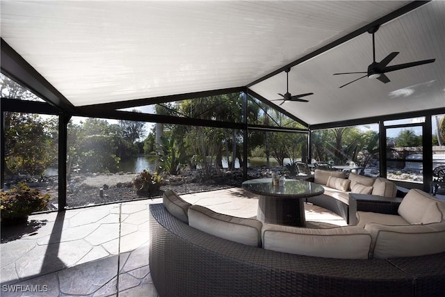 sunroom with vaulted ceiling with beams and ceiling fan