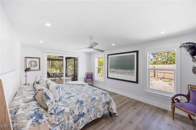 bedroom featuring light wood finished floors, access to outside, baseboards, and recessed lighting