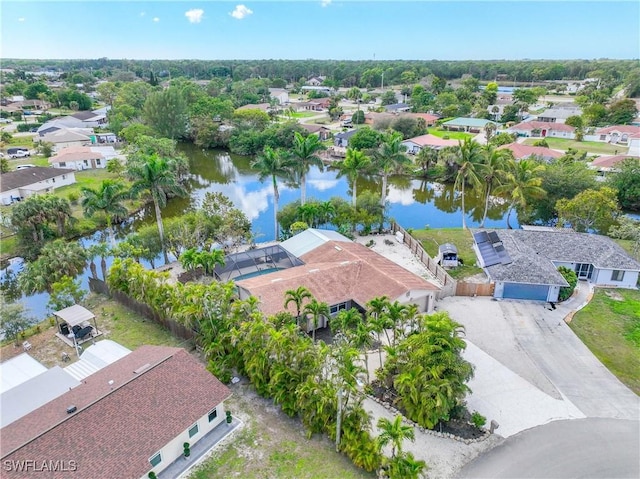 birds eye view of property featuring a residential view and a water view