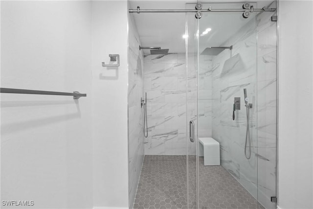 bathroom with a marble finish shower