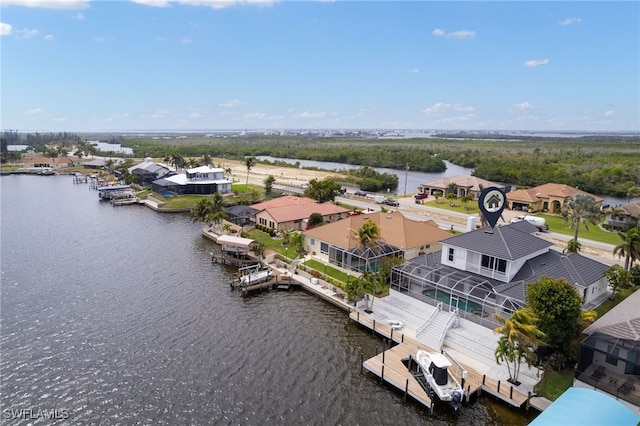 birds eye view of property with a residential view and a water view