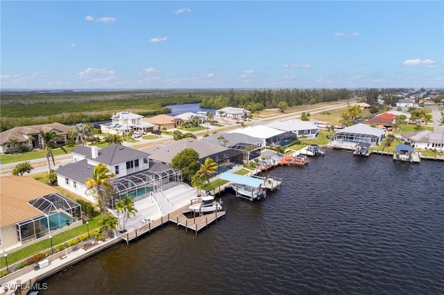 aerial view featuring a residential view and a water view