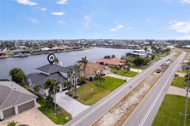 aerial view featuring a residential view and a water view