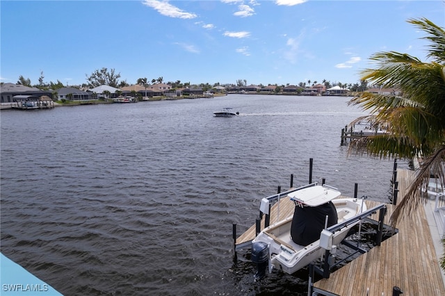 dock area featuring a water view and boat lift