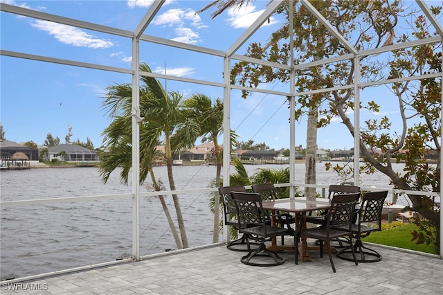 sunroom / solarium with a water view