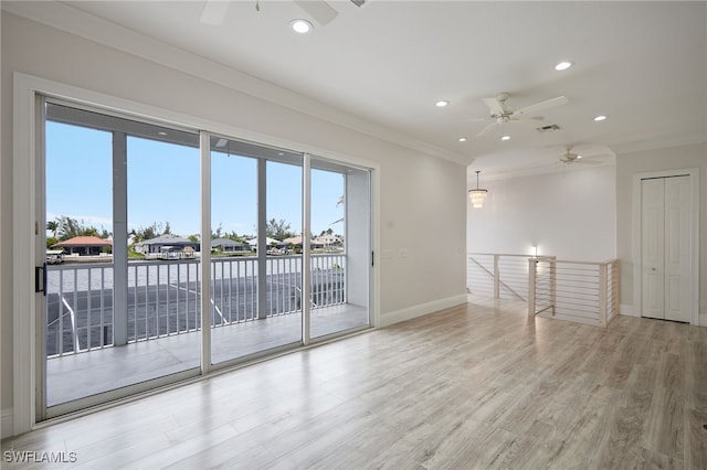 unfurnished room featuring recessed lighting, visible vents, a healthy amount of sunlight, and wood finished floors