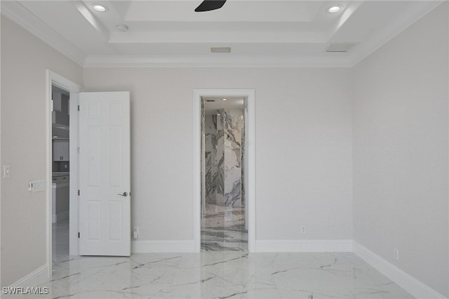 unfurnished room featuring a tray ceiling, recessed lighting, baseboards, and marble finish floor