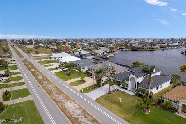 bird's eye view with a residential view and a water view