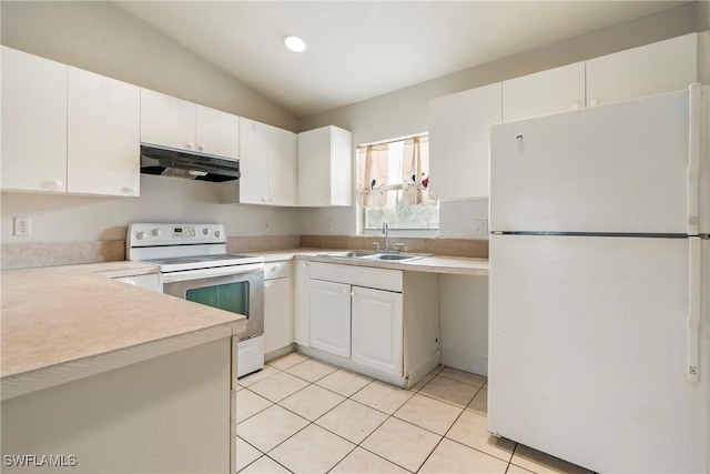 kitchen featuring light tile patterned floors, white cabinets, a sink, white appliances, and under cabinet range hood