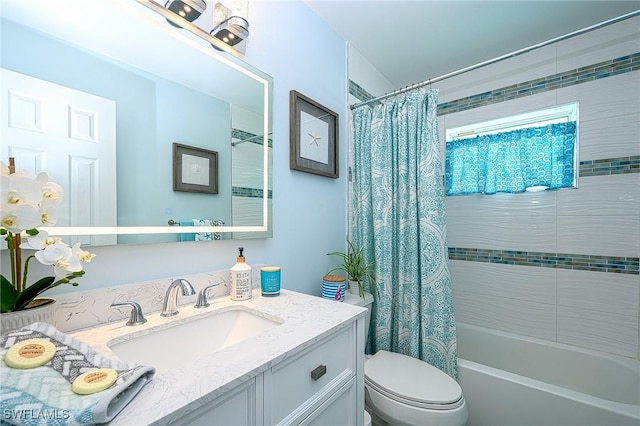 full bathroom featuring toilet, shower / bathtub combination with curtain, and vanity