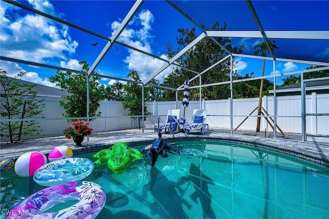 view of swimming pool featuring a fenced in pool, a lanai, a fenced backyard, and a patio