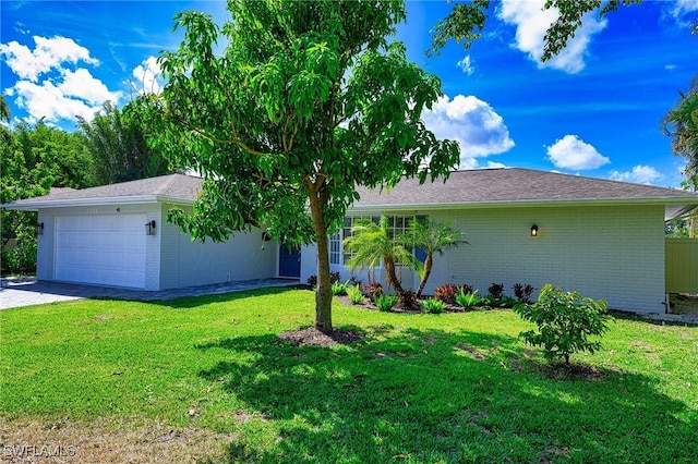 single story home featuring a garage, a front lawn, decorative driveway, and brick siding