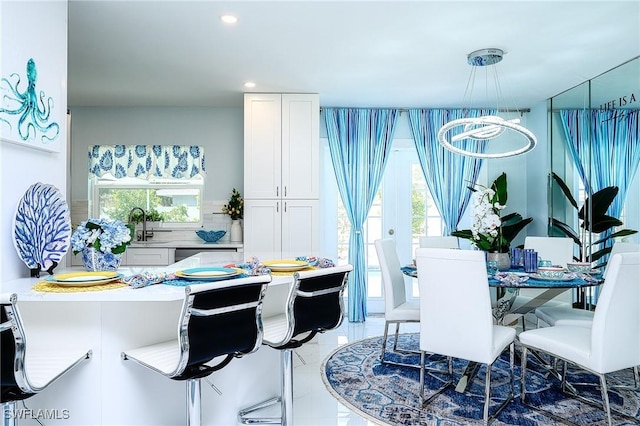 dining area with marble finish floor and recessed lighting