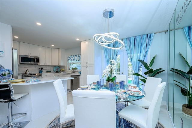 dining room featuring recessed lighting and an inviting chandelier