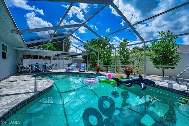 view of swimming pool with a fenced in pool, a patio area, a fenced backyard, and a lanai